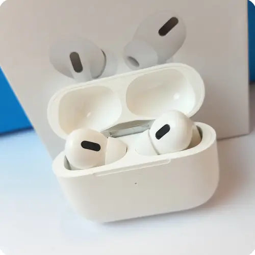 A pair of white Airs Pro TWS Bluetooth Earbuds in their charging case, with a green indicator light visible on the case.