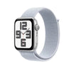 This image features the Apple Watch SE in a 44mm size, showcased with a sleek silver case and a matching silver band. The watch face displays a bold, analog dial with a simple design, enhancing its stylish yet functional appeal.