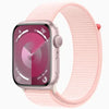 This image features the Apple Watch Series 9 in a 45mm size, showcased with a sleek pink band and a matching pink case. The watch face displays a vibrant, detailed interface with various app icons and a prominent digital crown on the side.