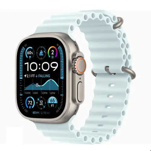 This image features the Apple Watch Ultra 2 (2024) with a sleek metallic silver case and a light blue silicone band. The watch face is adorned with a digital display showing the time, date, and various health and fitness metrics.