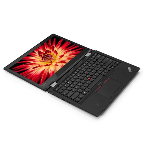 Lenovo ThinkPad L380 displaying a vibrant red and orange abstract design on a white background