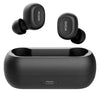 A pair of black QCY T1C TWS Bluetooth earphones placed above their black charging case.
