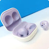Samsung Galaxy Buds 2 earphones in purple color, placed inside their charging case.