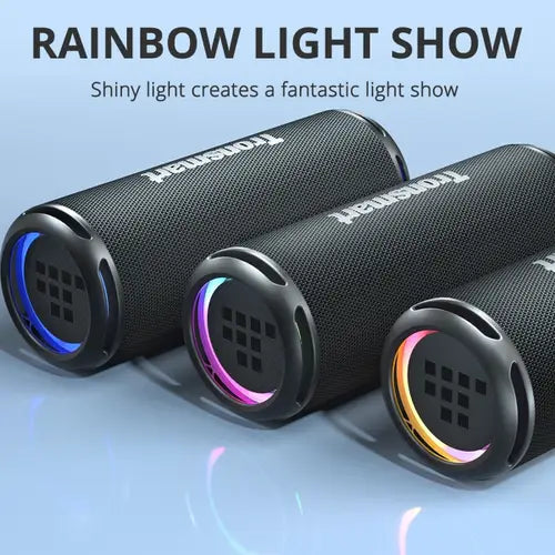 Tronsmart T7 Lite Portable Outdoor Speake in black color electronic devices with colorful lights on a blue background, labeled 'Rainbow Light Show'.