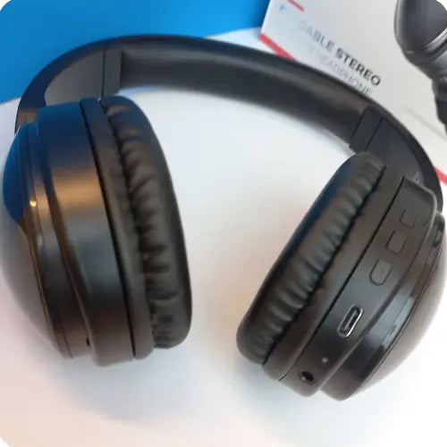 A pair of XO BE36 Portable Wireless Bluetooth Headphones in black color, displayed alongside its packaging 2.