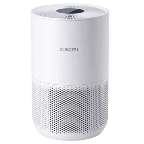 The Xiaomi Smart Air Purifier 4 Compact sits elegantly on a pristine white background, its sleek design accentuated by the prominent Xiaomi logo and a mesh of precision-crafted holes.